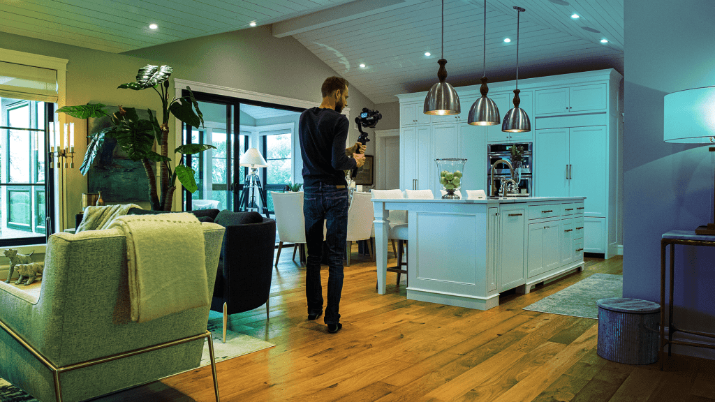 Location scout photographing inside of host home